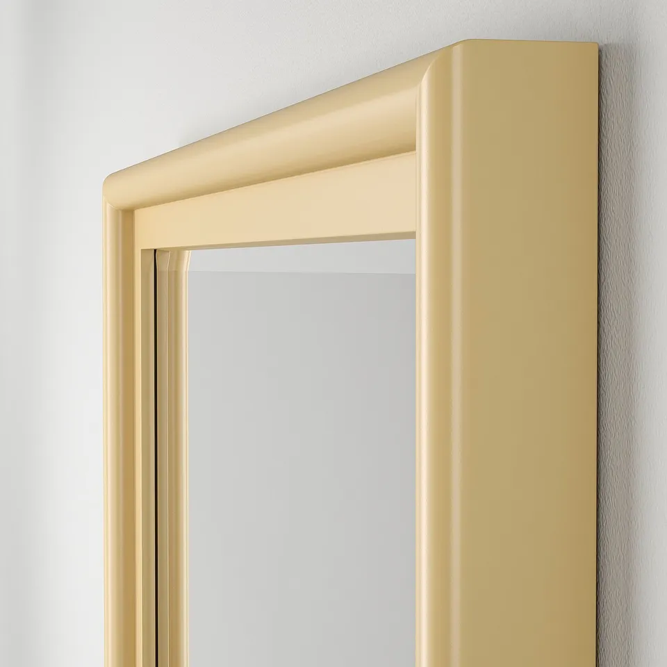 High-quality mirror with bevelled glass edges in a stylish, solid pine frame, mounted on a white wall.