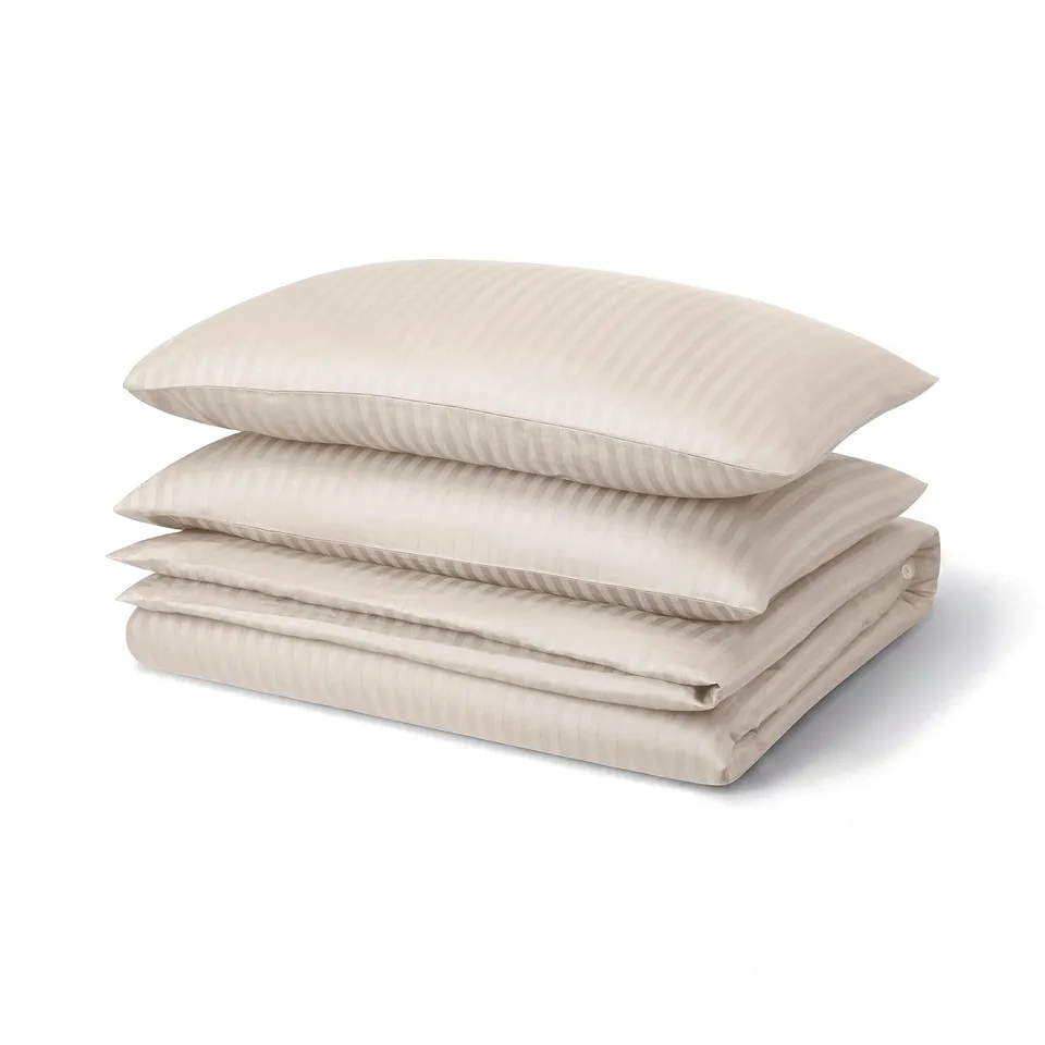 Natjasmin bed set: beige, sateen, rectangular, folded, subtle stripes.