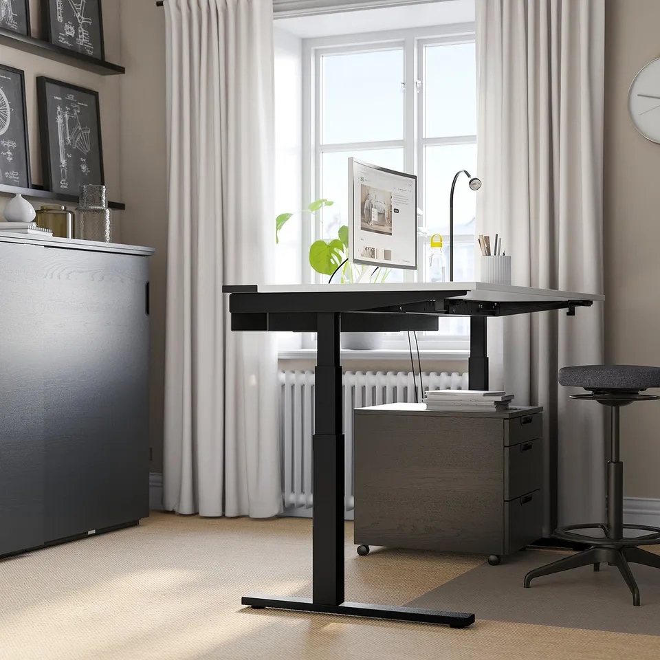 MITTZON: sleek black sit/stand desk, modern office setup with monitor, chair, & files. Tall, sturdy with adjustable height.