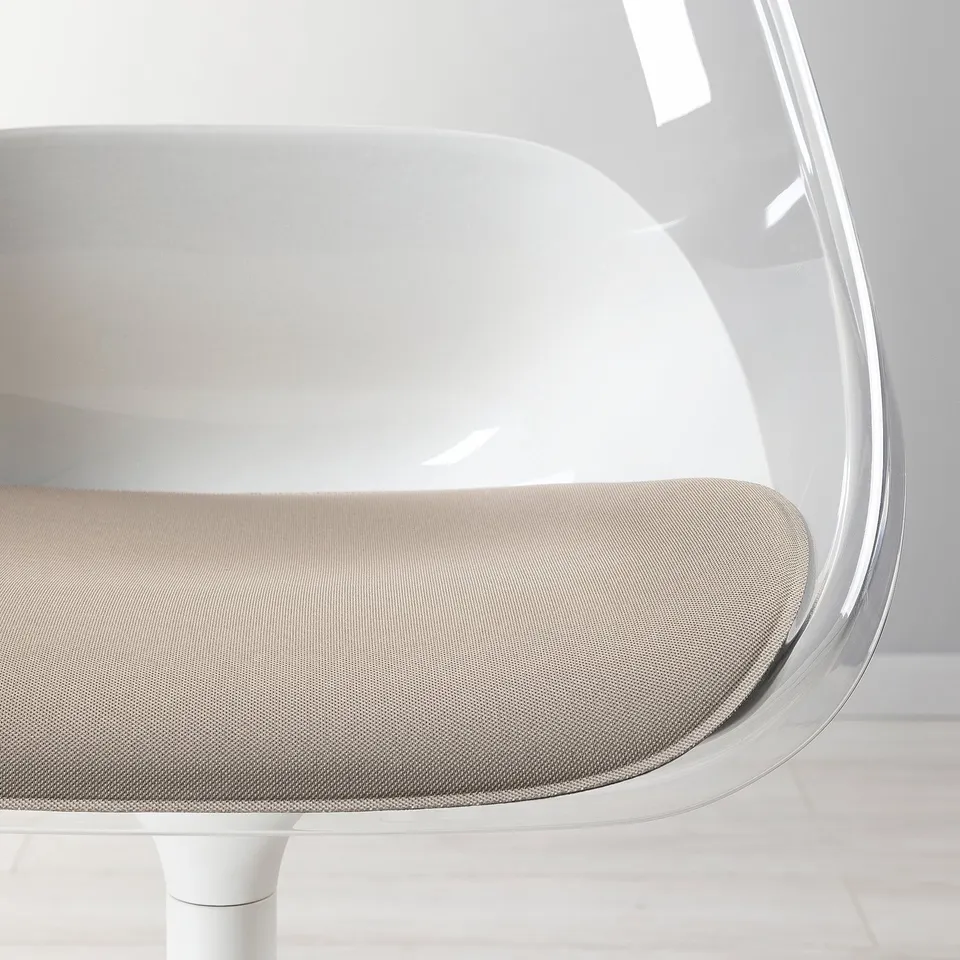 Clear plastic seat shell, light grey fabric cushion, white swivel base. Well-designed, comfy, and easy to clean.
