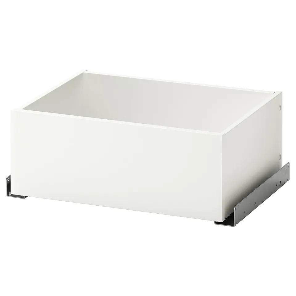 An ikea KOMPLEMENT white drawer, ideal for organizing clothes, with a minimalist design and a soft-close mechanism.