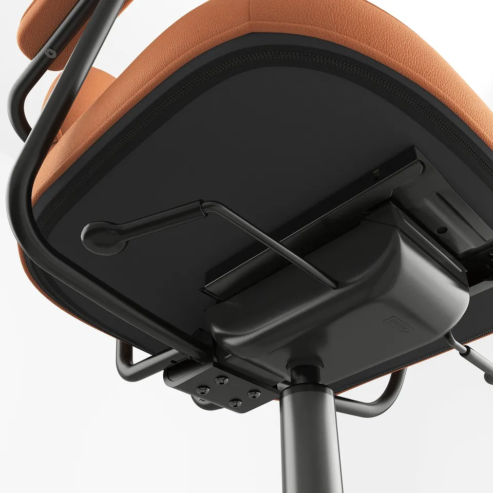 Ergonomic chair base detail: robust metal frame, sturdy black plastic components, orange cushioned seat with visible stitching.