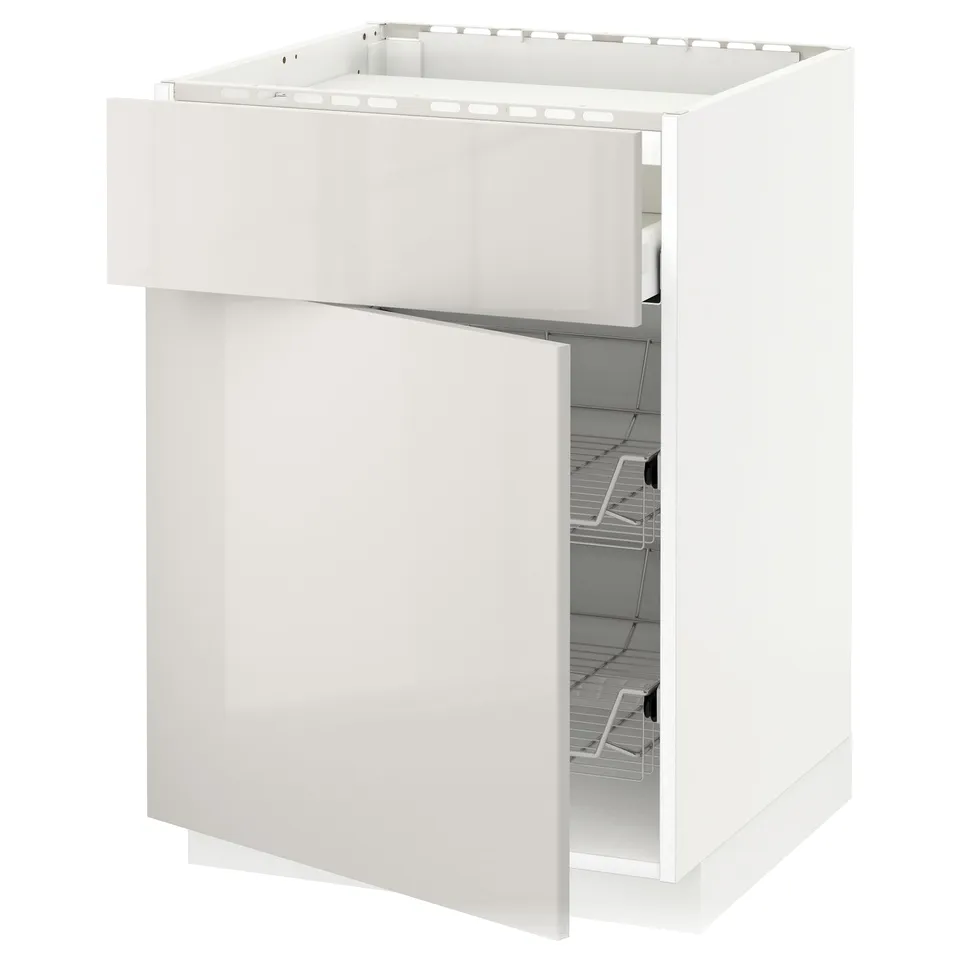 White kitchen cabinet with open drawer. Modern, glossy finish. Wire basket inside drawer. Square shape, sleek design.
