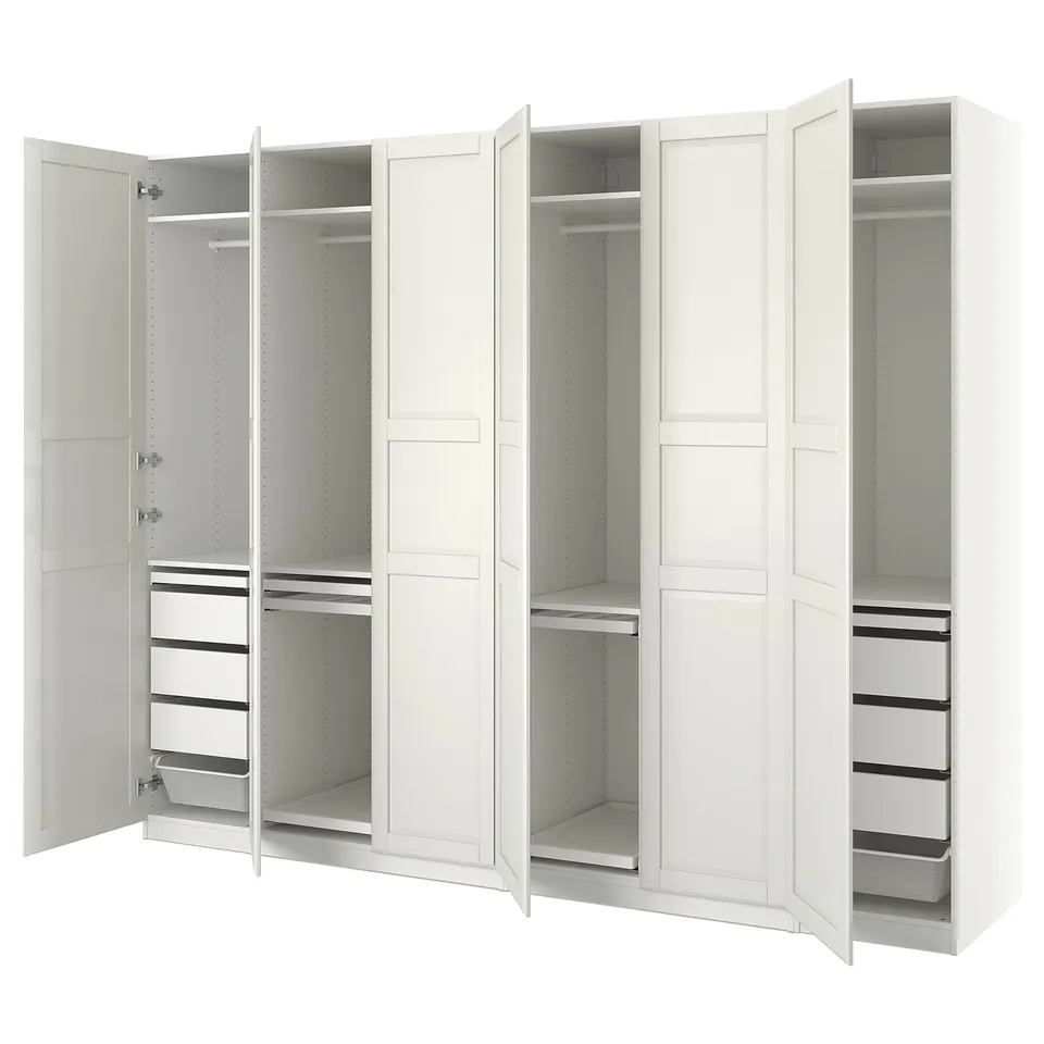 This image shows a white ikea PAX wardrobe. It has multiple compartments, drawers, and shelves for storage, featuring a clean, minimalist design.