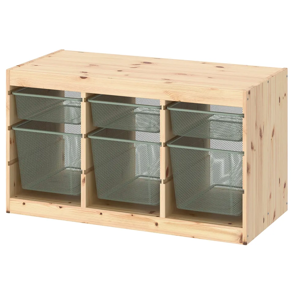 A TROFAST wooden storage unit with natural pine colour, featuring mesh boxes for organising items. It has a rectangular shape with a sturdy design.