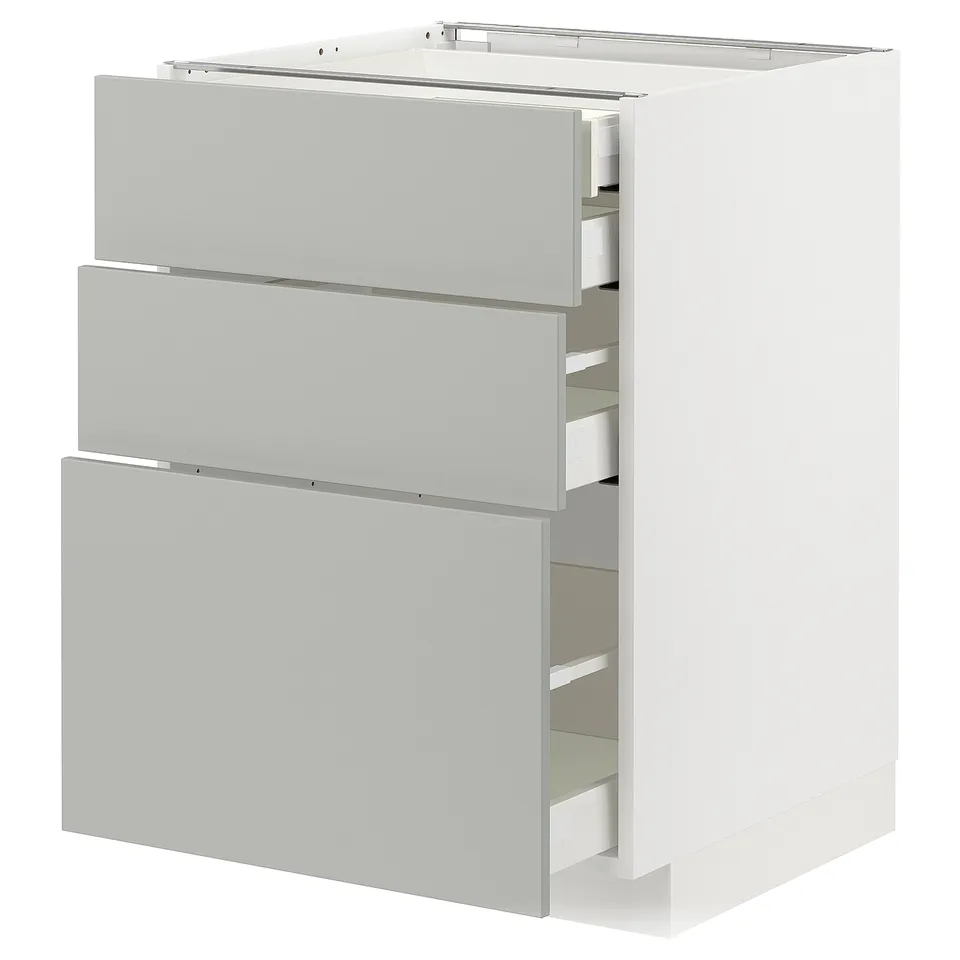 A white METOD cabinet with grey drawers. It three drawers with sleek, modern design.