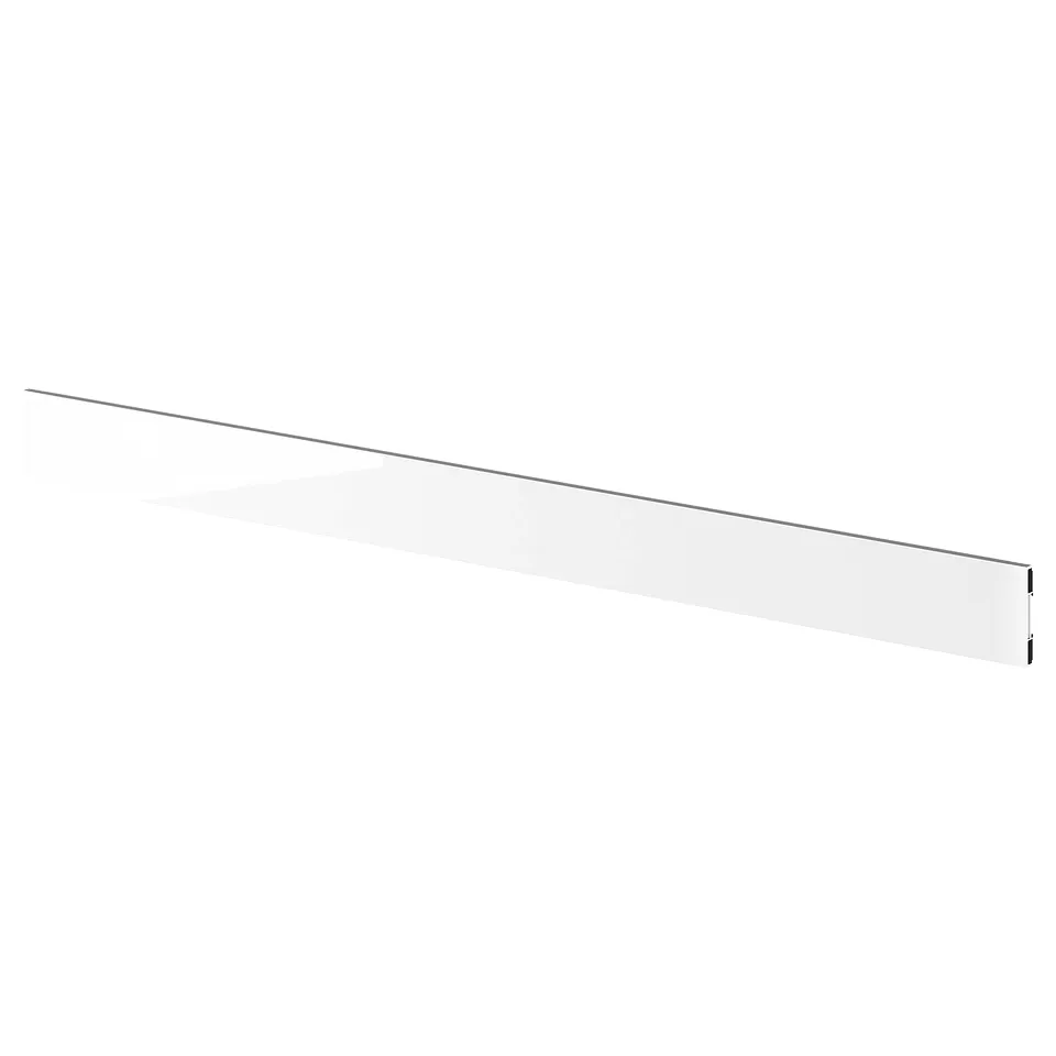 A glossy, white kitchen plinth made of plastic, designed to fit seamlessly under base cabinets.