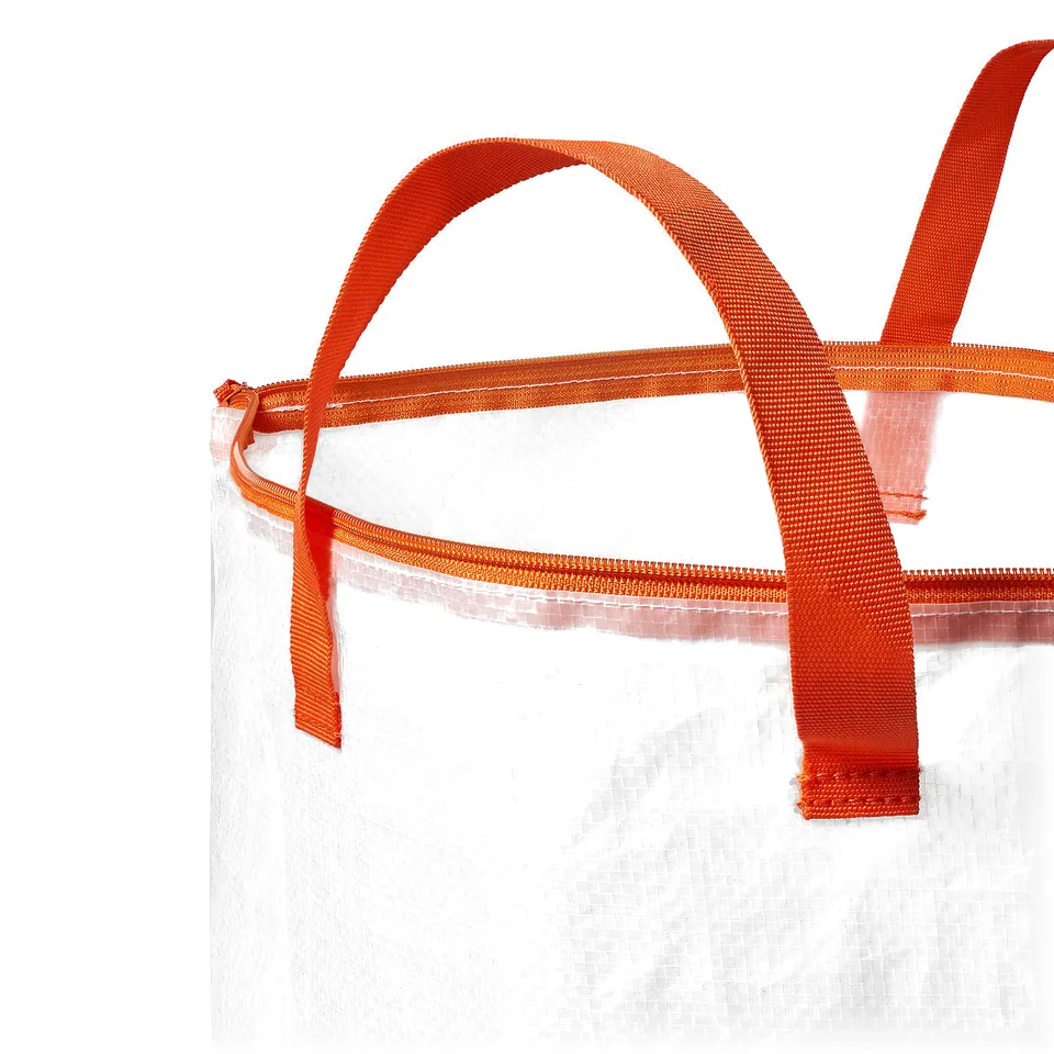 A white mesh laundry bag with thick, sturdy orange straps and zip.