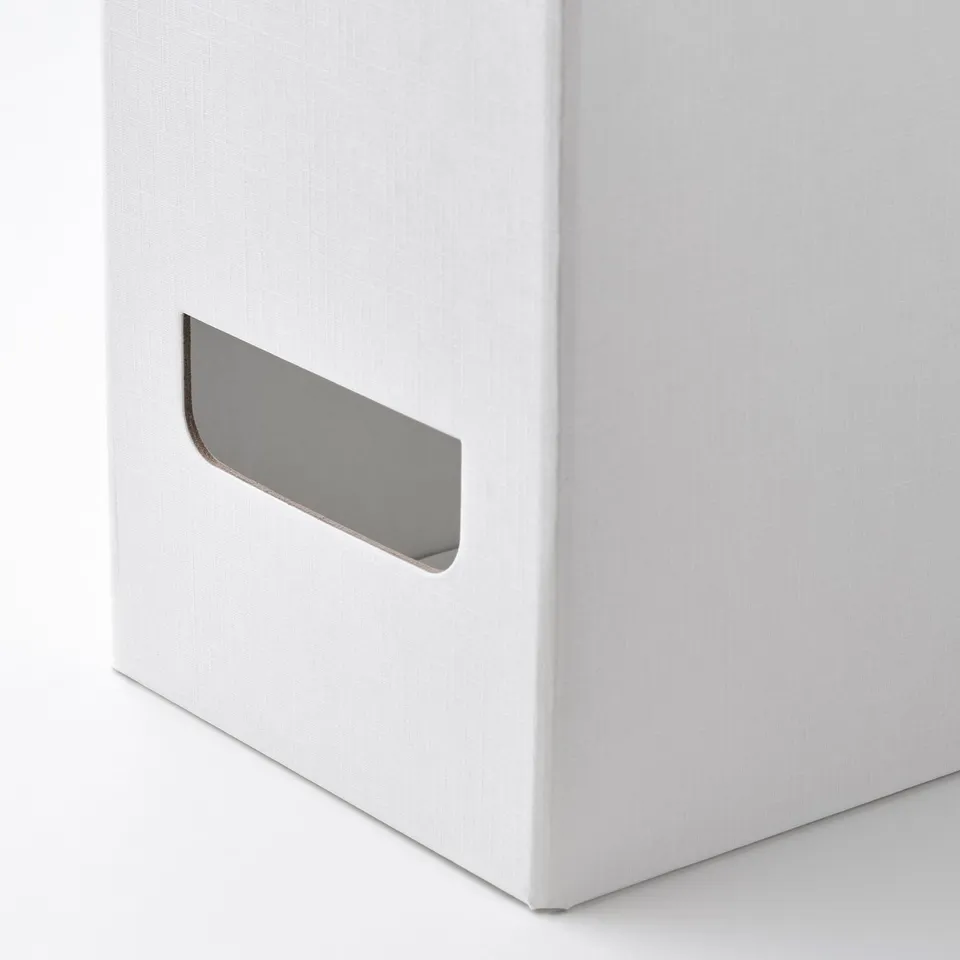 A white magazine file with a metallic pull handle on the side. The handle is securely attached, ensuring easy access for pulling out the file.