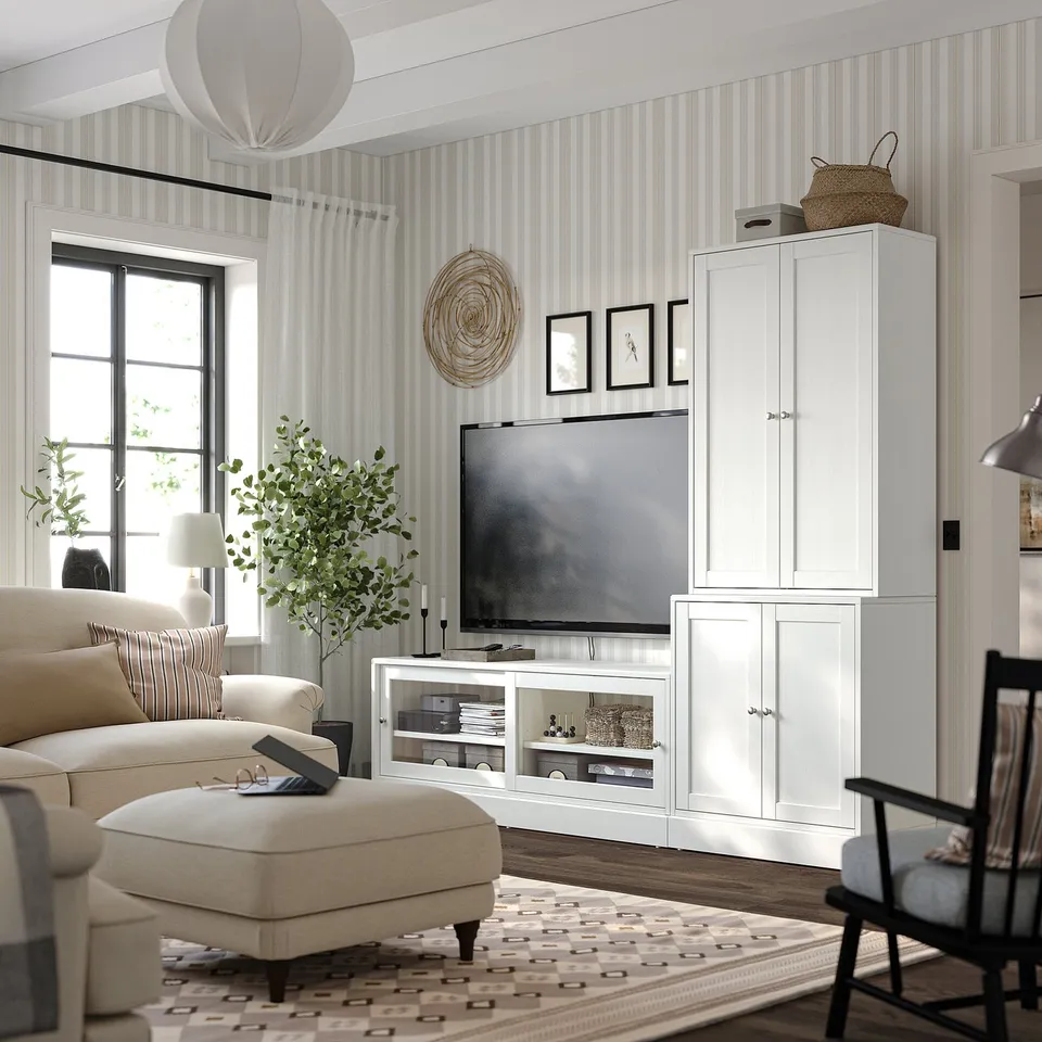 Modern living room with HAVSTA white pine tv unit, beige sofa, and geometric rug.