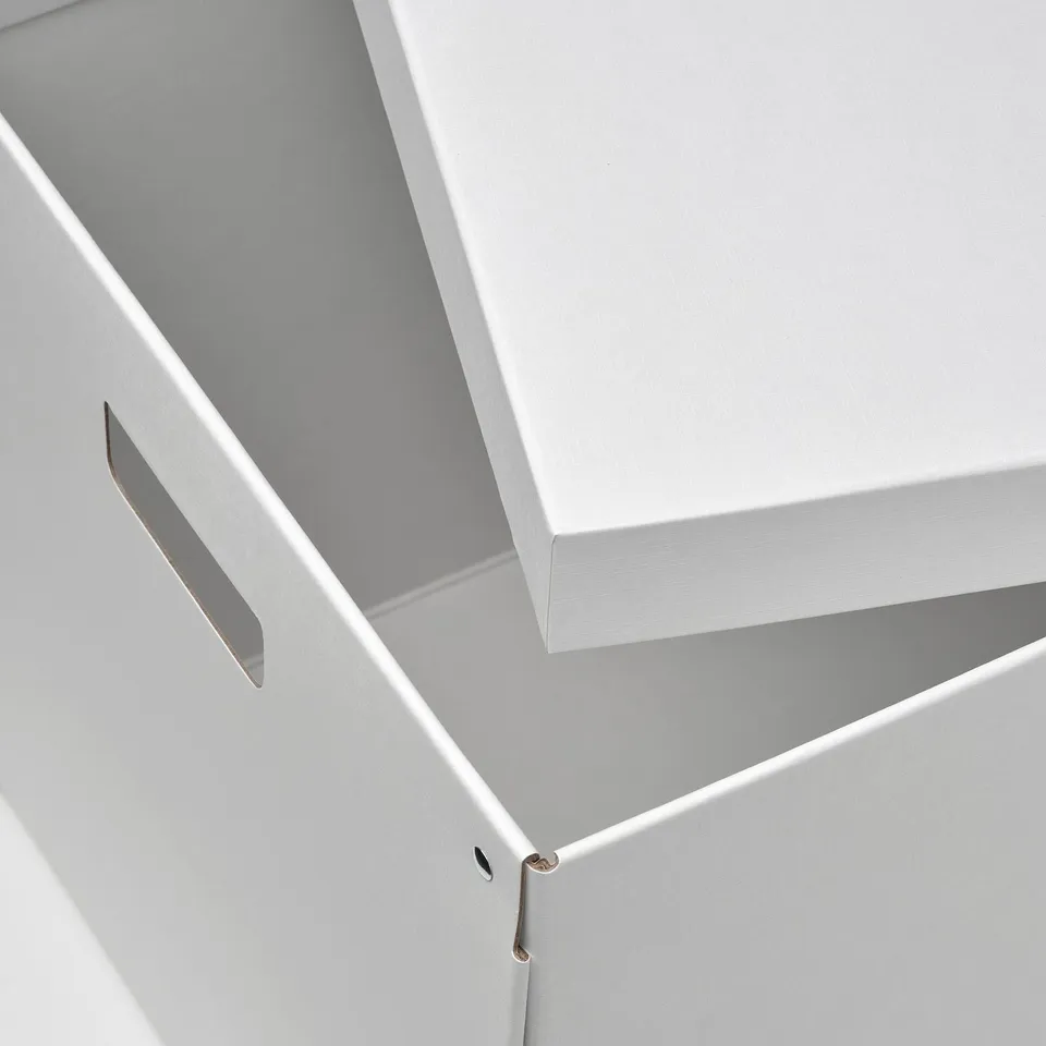 White box with cut-out handles, showing high-quality craftsmanship.