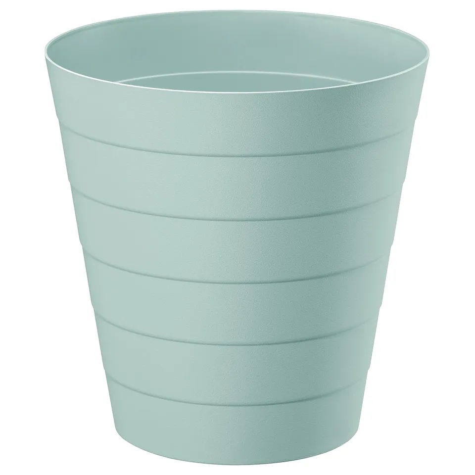 A FNISS waste bin in turquoise. Its made of durable recycled polypropylene. The bins cylindrical shape clean horizontal lines.