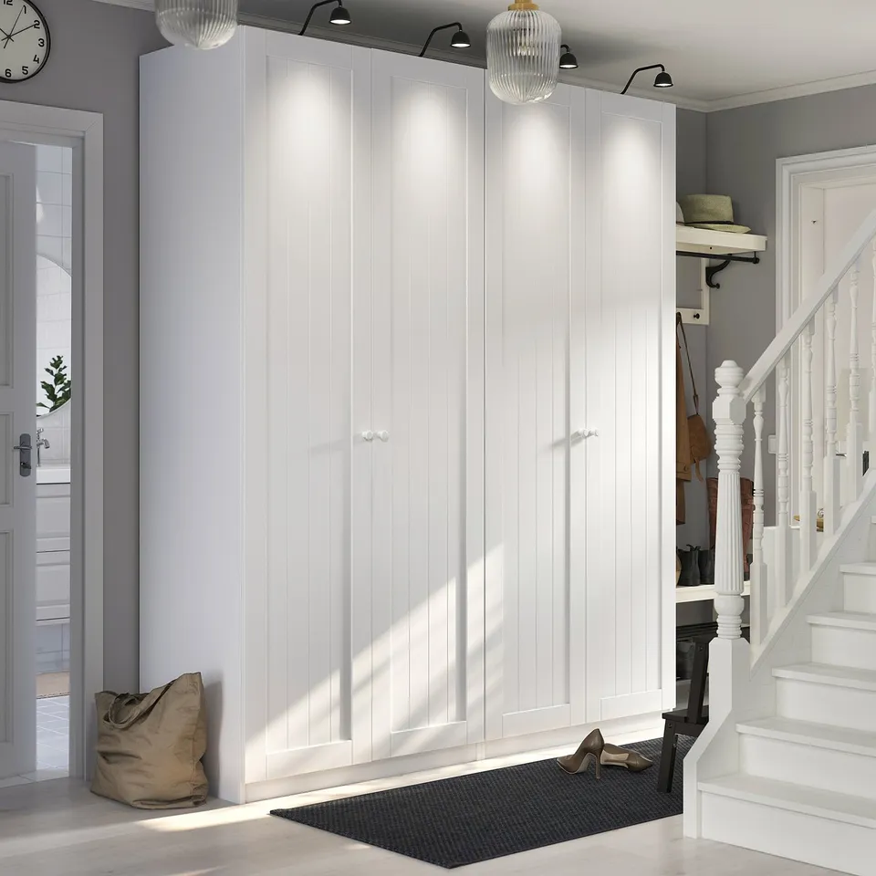 White PAX wardrobes in hallway with lights, ceiling, stairs, door, coat rack.
