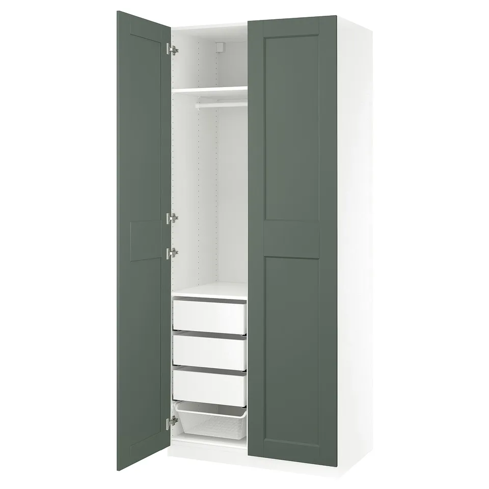 An open white and teal green PAX wardrobe with drawers and shelves.