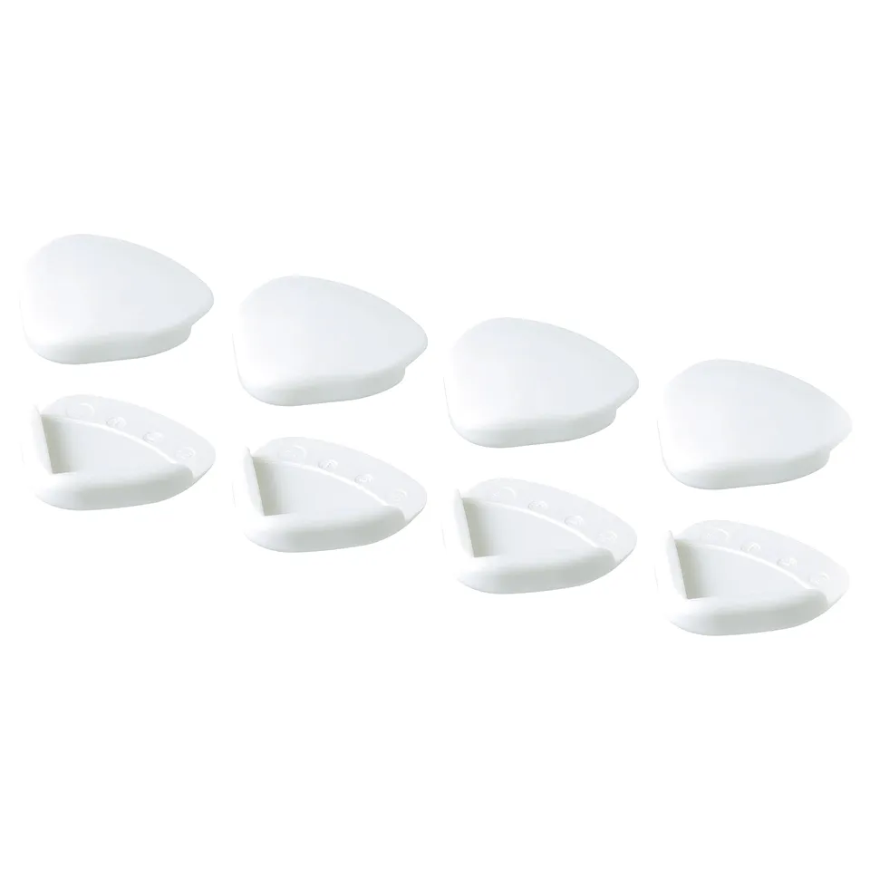 Eight white teardrop-shaped foam corner protectors arranged in two rows.