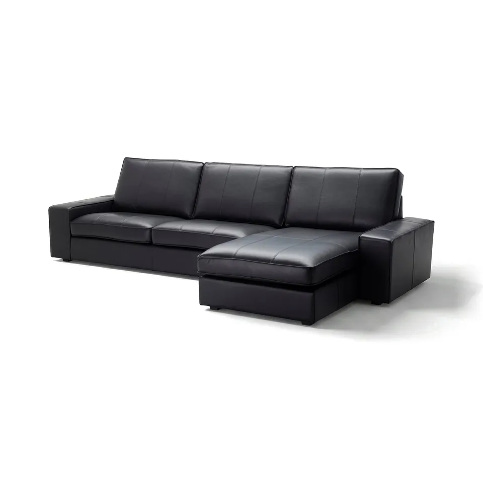 Black KIVIK sectional sofa. Modern, low design with deep, padded cushions for comfort. Premium leather upholstery, square arms, and wooden legs.