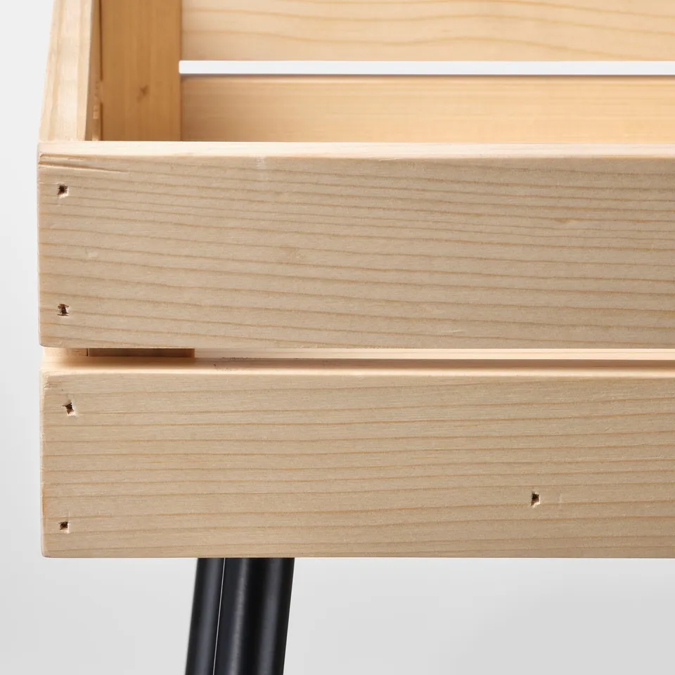 Modern wooden shelf with sleek black metal legs, showcasing fine grain and high-quality finish.