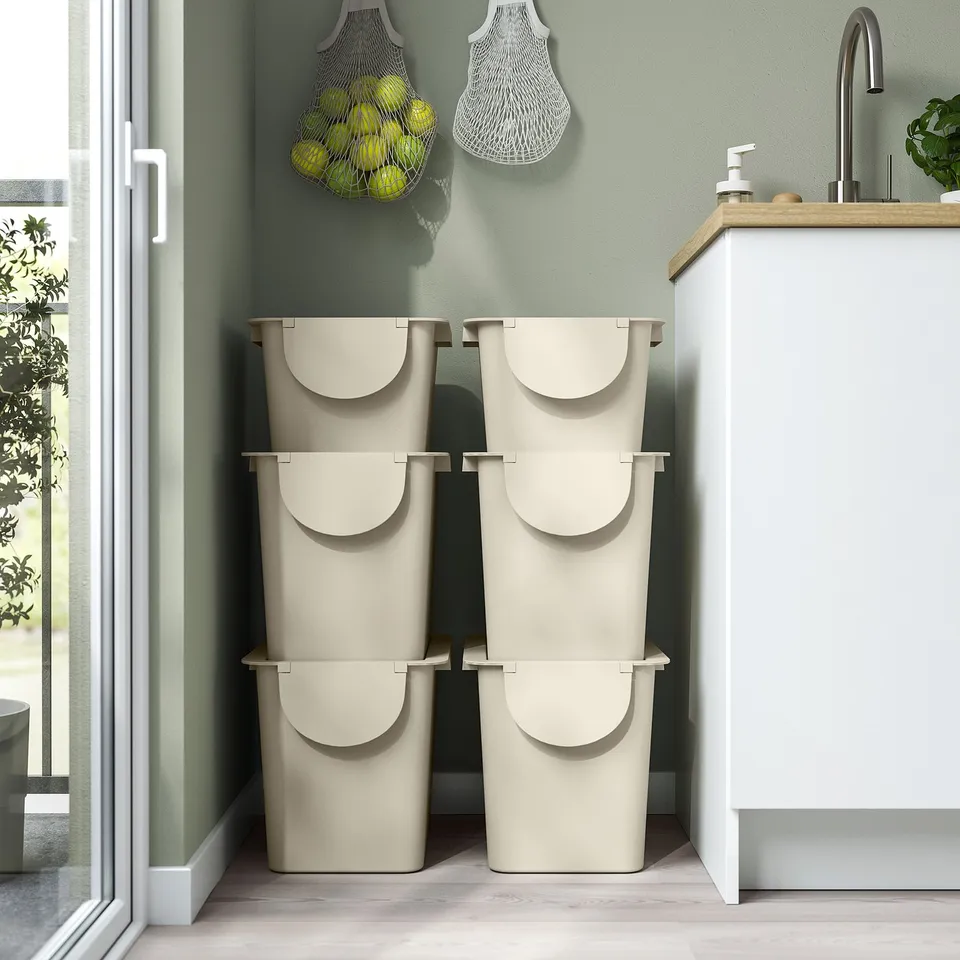 Two stacked TRÖSKNING bins for waste sorting and storage in kitchen, under cabinet, with lids.