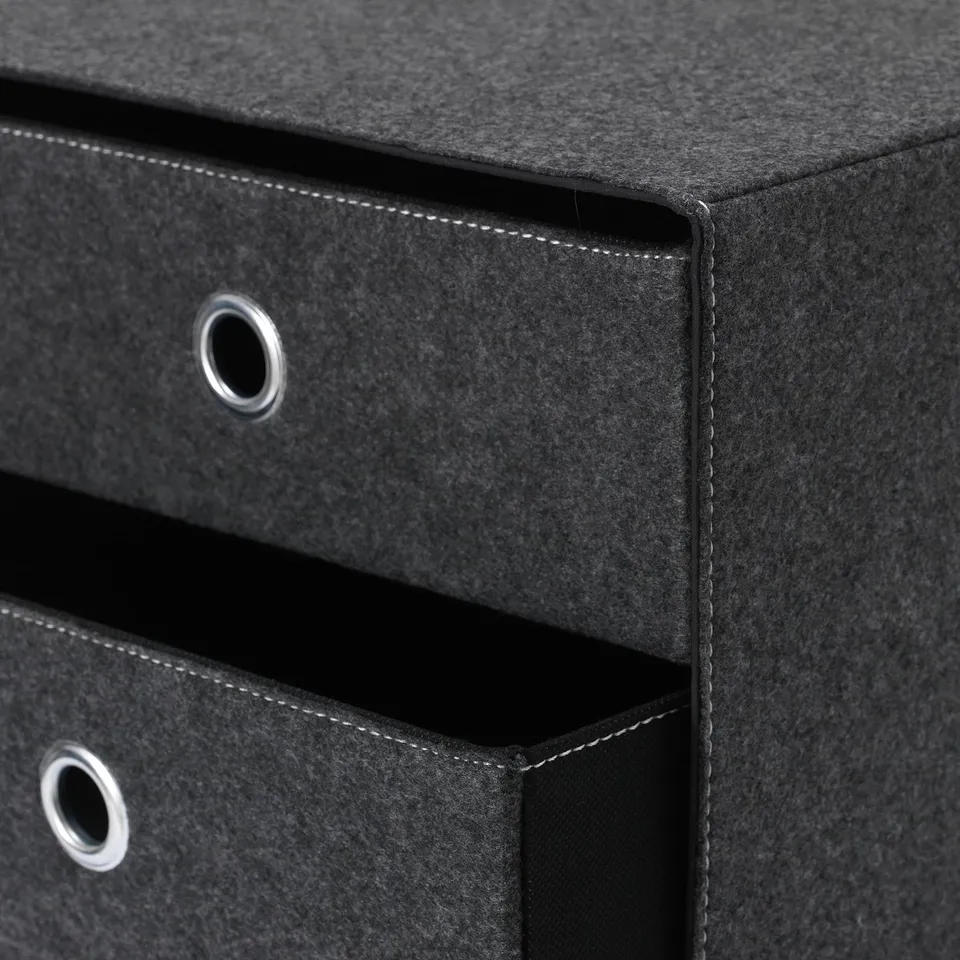 Black fabric storage box with metal handles, featuring sturdy stitching and smooth surfaces.