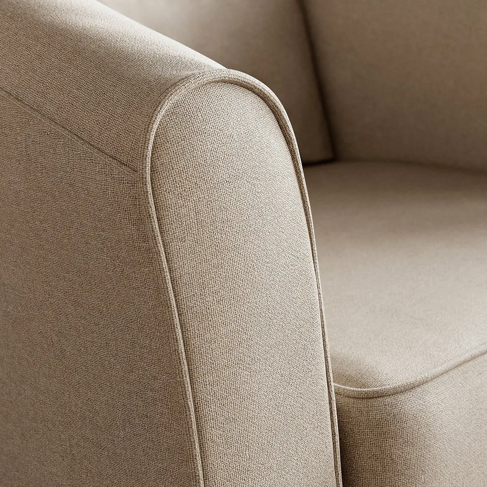 Close-up of a stylish, beige upholstered chair, showcasing its quality fabric and sleek design.