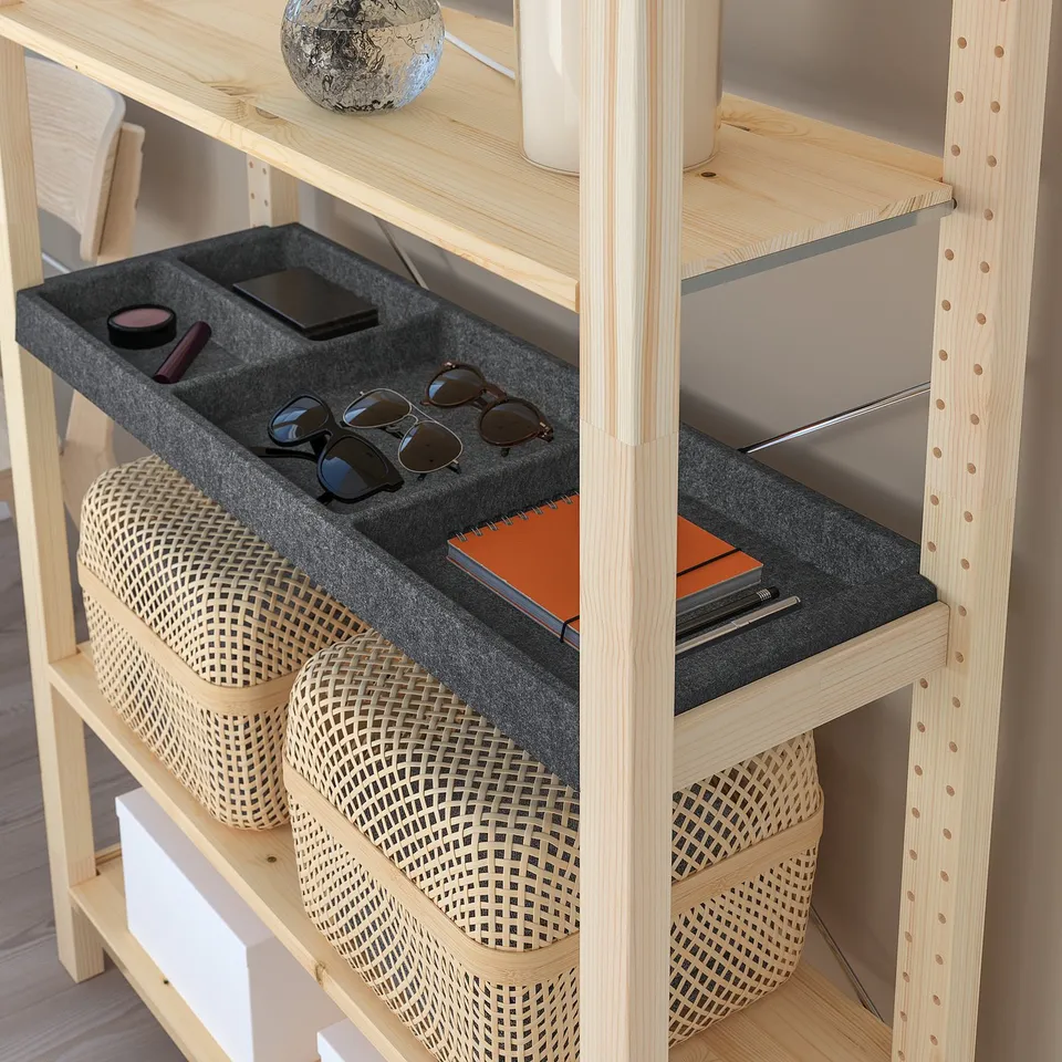 Shelf with felt compartments organises sunglasses, pens, and small items.