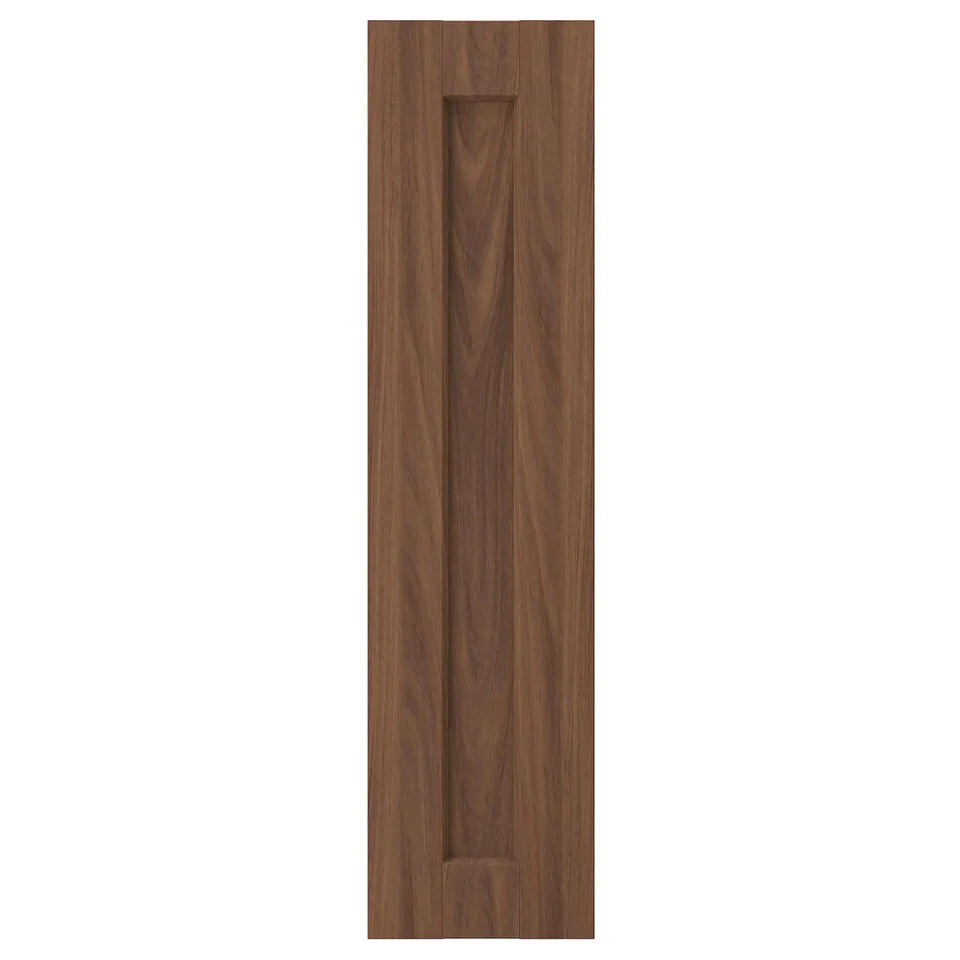 Depicts a brown walnut ENKÖPING cabinet door with a vertical recessed pull handle. Its rectangular, framed, and a subtle wood grain pattern.