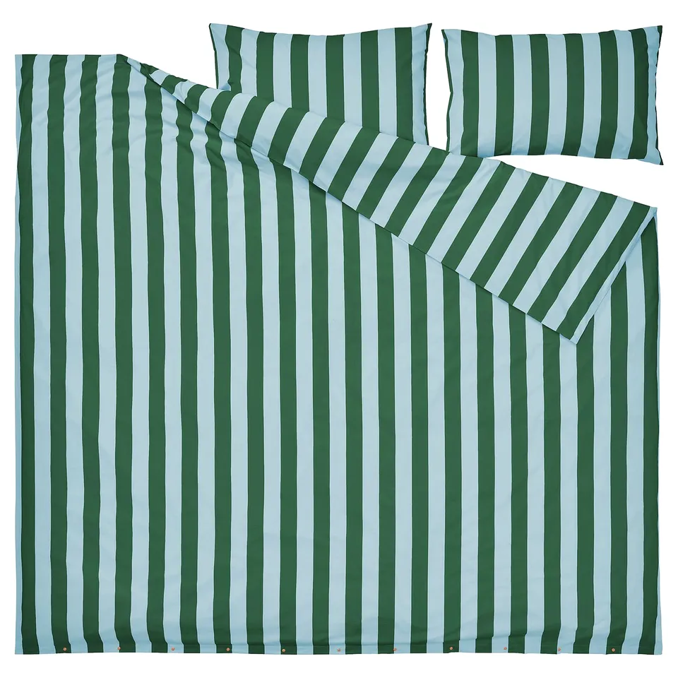 A green and white striped SLÅNHÖSTMAL bedding set, featuring a duvet cover and pillowcases made from durable cotton and lyocell fabric.