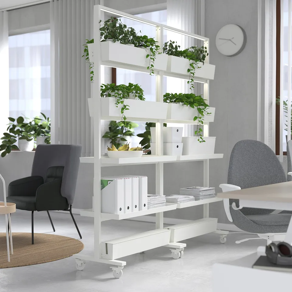 MITTZON metal shelving with wheels, holding plants for green office partition.
