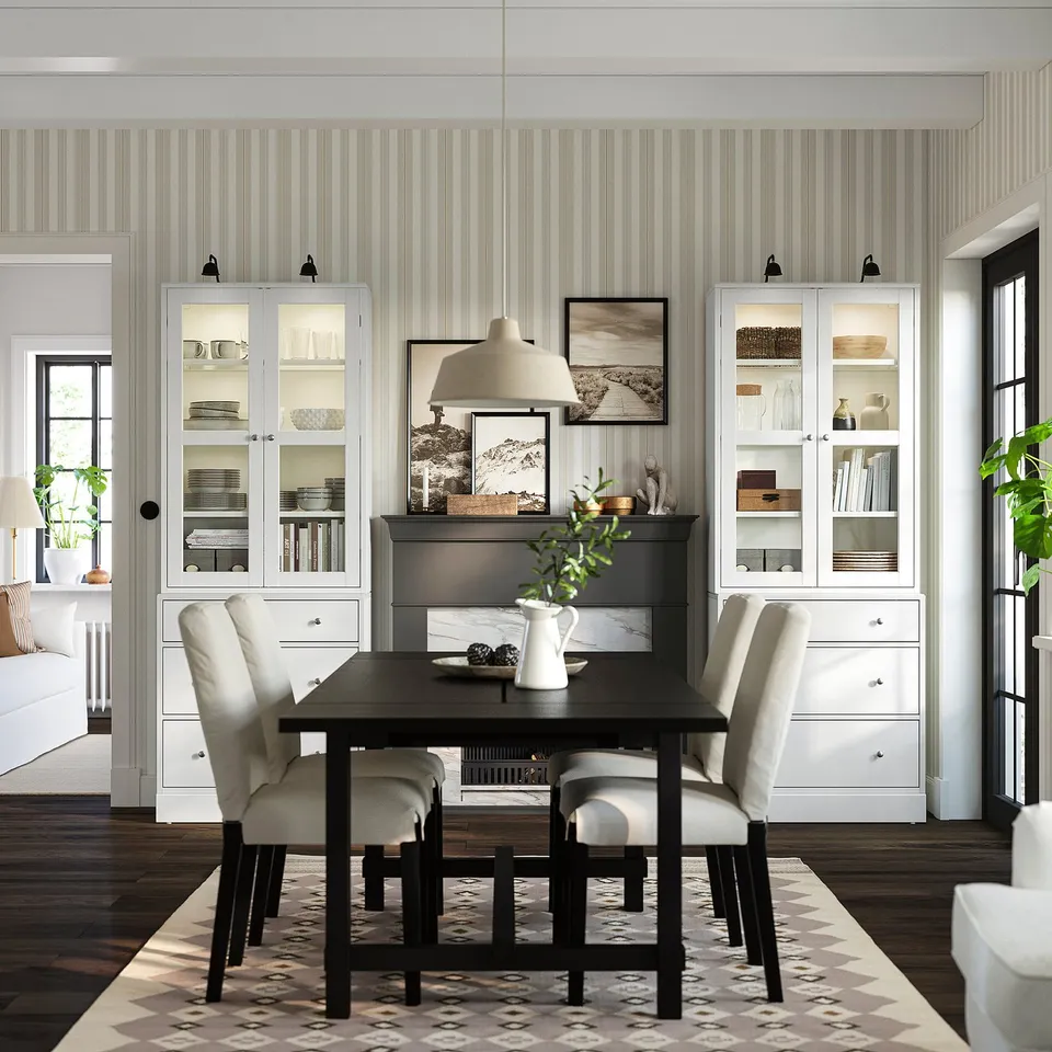 HAVSTA storage in light grey with pine & glass flanks dark table & cream chairs for a cosy, organised dining room.