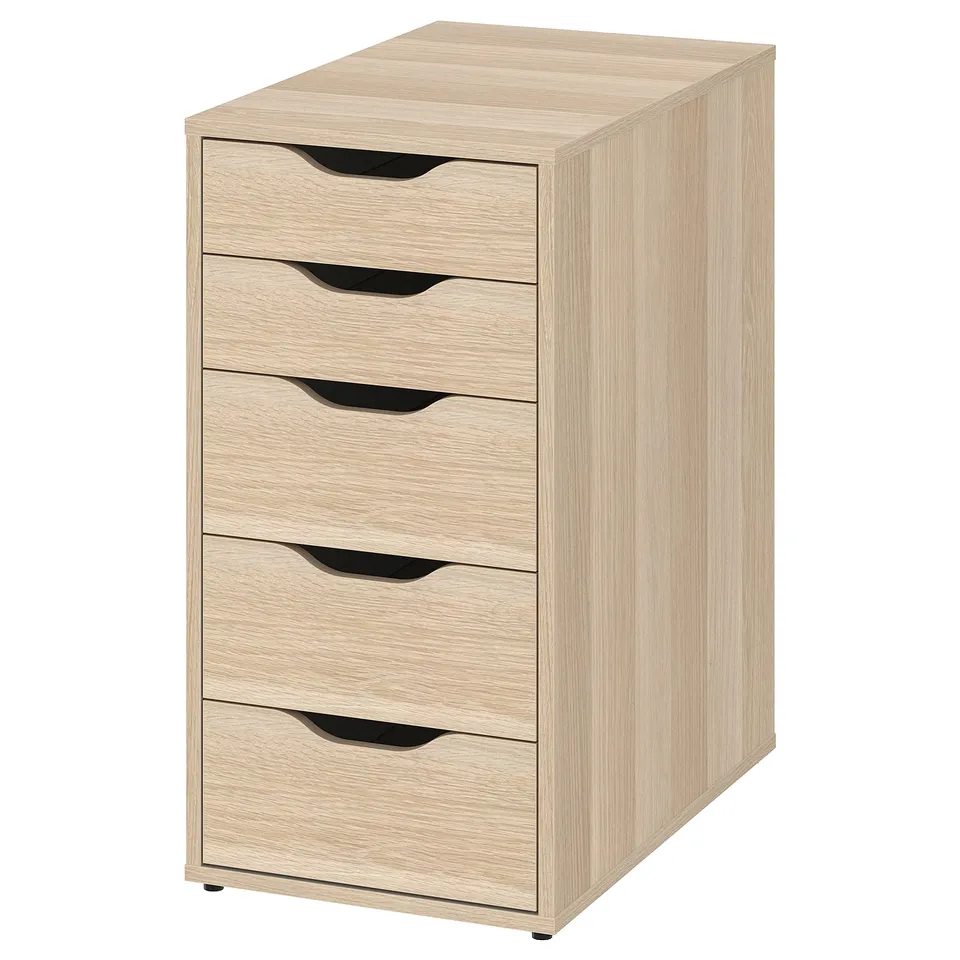 An ikea LAGKAPTEN desk in oak color with five drawers featuring cut-out handles, providing ample storage in a compact, rectangular shape.