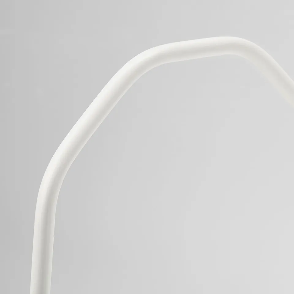 Arch-shaped white handle on a light table. Smooth, sleek design with high edges. Sturdy, easy to lift and carry.
