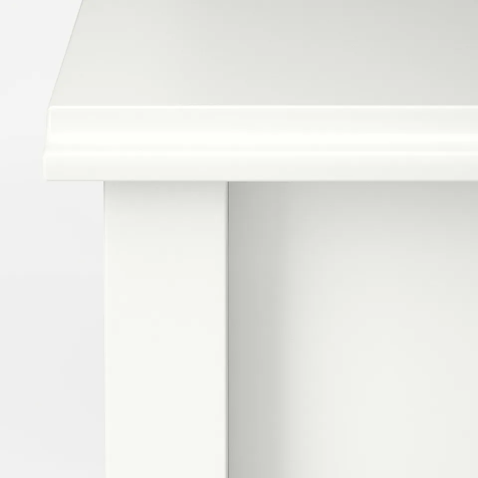 Modern, minimalist coffee table with smooth, white finish and clean lines, showcasing high-quality craftsmanship.