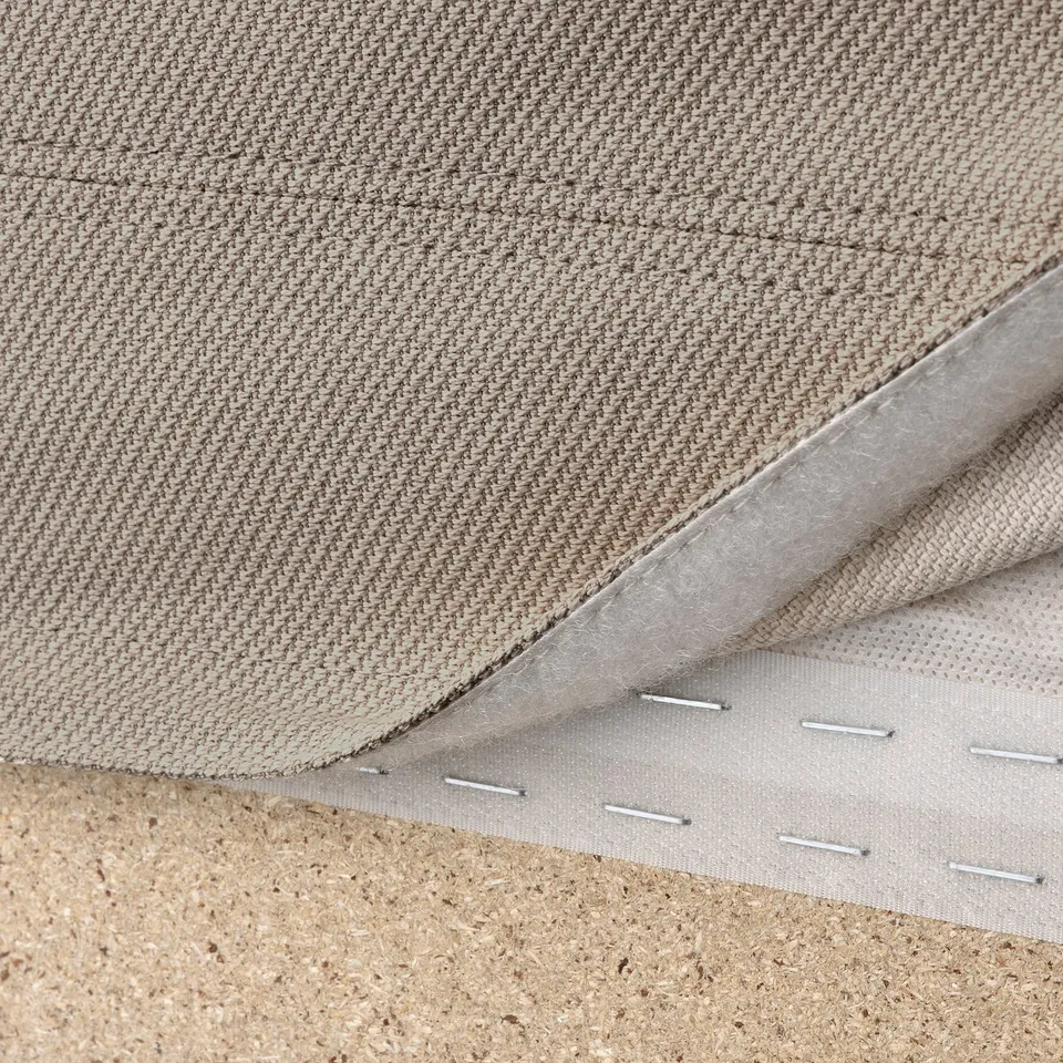Close-up of VIMLE sofas removable, machine-washable hallarp fabric cover, showcasing stitching and lining.