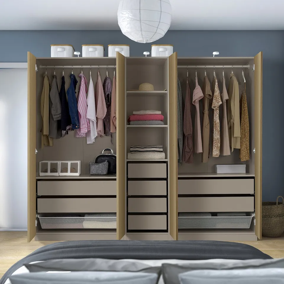 Open wardrobe with clothes, accessories, shelves, drawers and adjustable compartments.