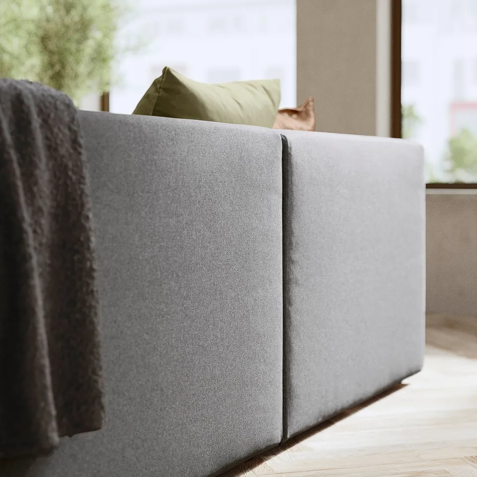 Modern grey JÄTTEBO sofa, soft fabric, clean lines, comfy design with cushions.