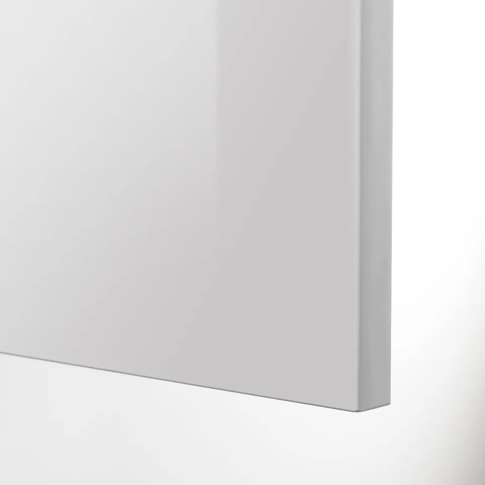 Close-up of sleek, modern kitchen cabinet in high gloss grey, showcasing smooth finish and clean lines.