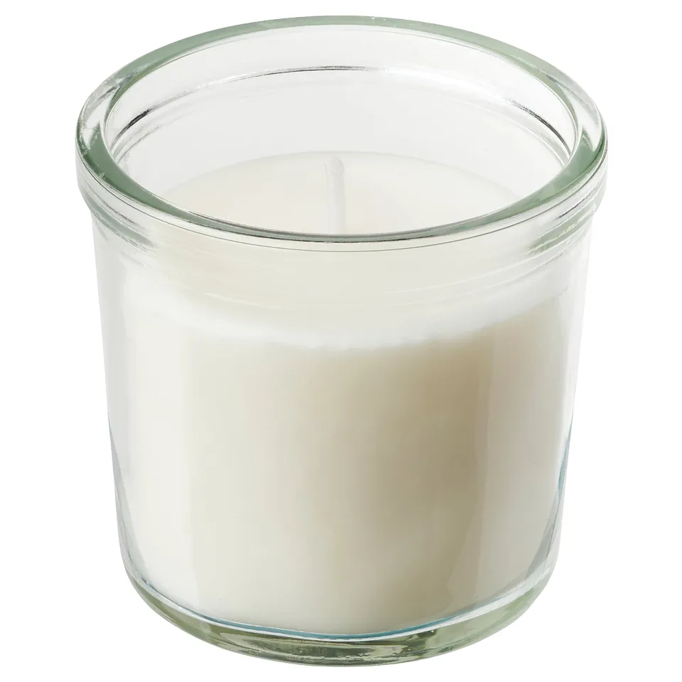 Glass candle jar with white wax, two wicks. Simple, clear design.