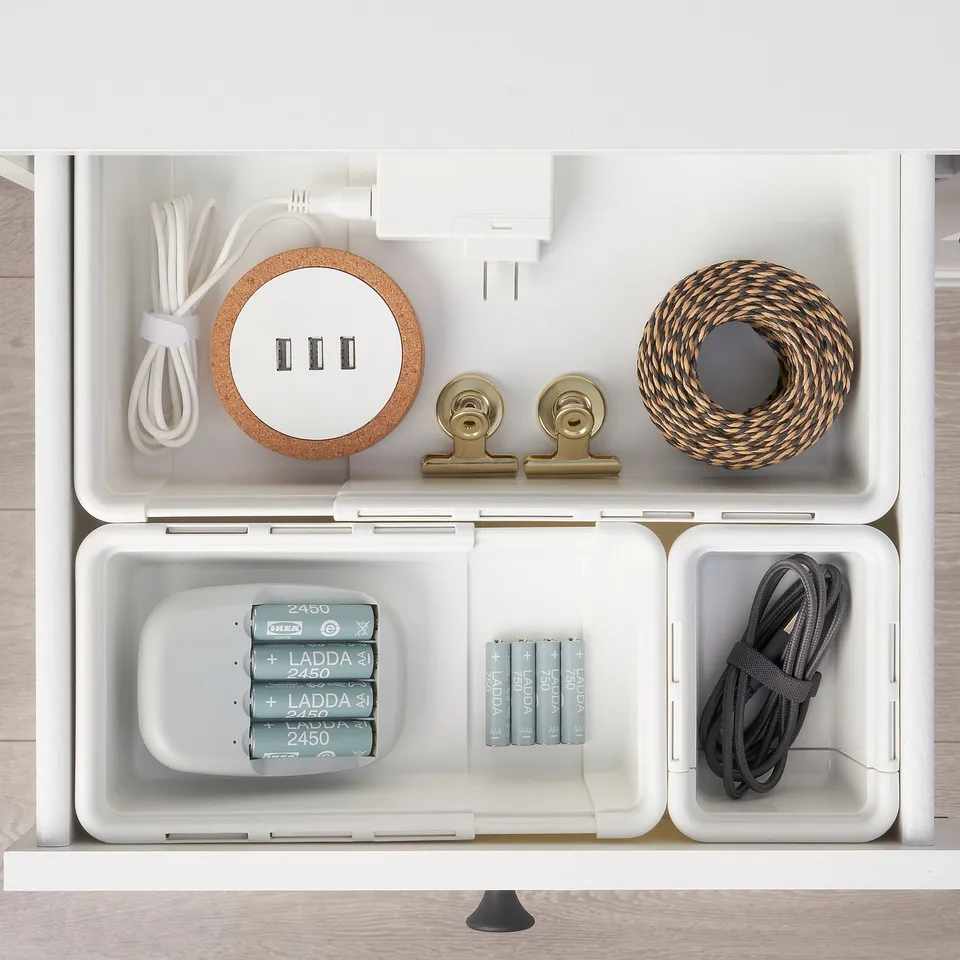 Organised drawer with KACKLA boxes storing cables, charger, clips, and batteries.