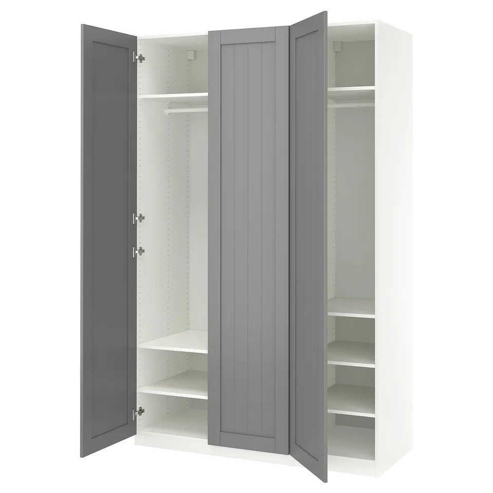 A white PAX wardrobe with grey doors open, revealing the interior shelves.