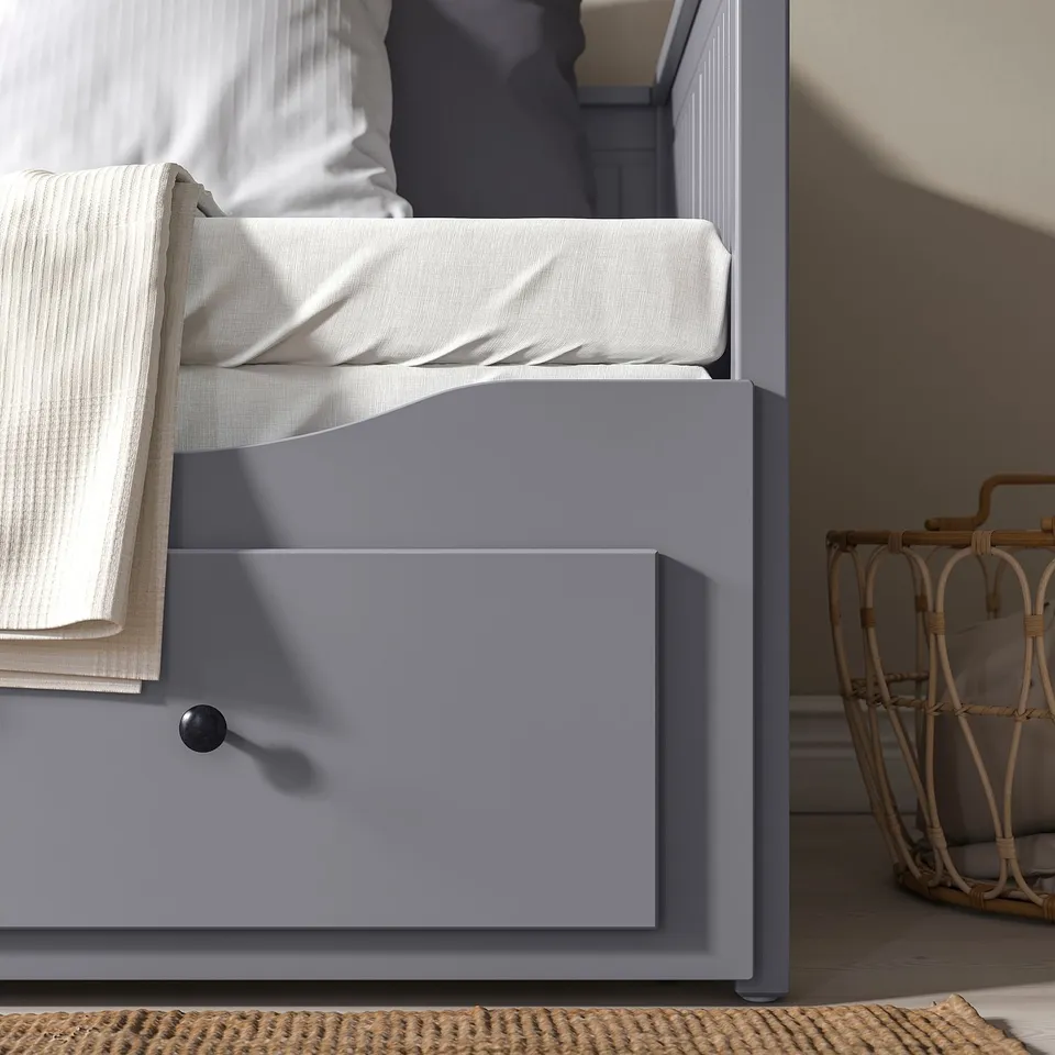 Grey day-bed with mattresses; converts to double bed, offers storage below.