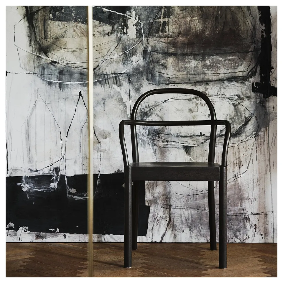 STOCKHOLM 2025 chair in black. Modern scandinavian design with steam-bent solid beech backrest. Compact, elegant, perfect for dining or living spaces.