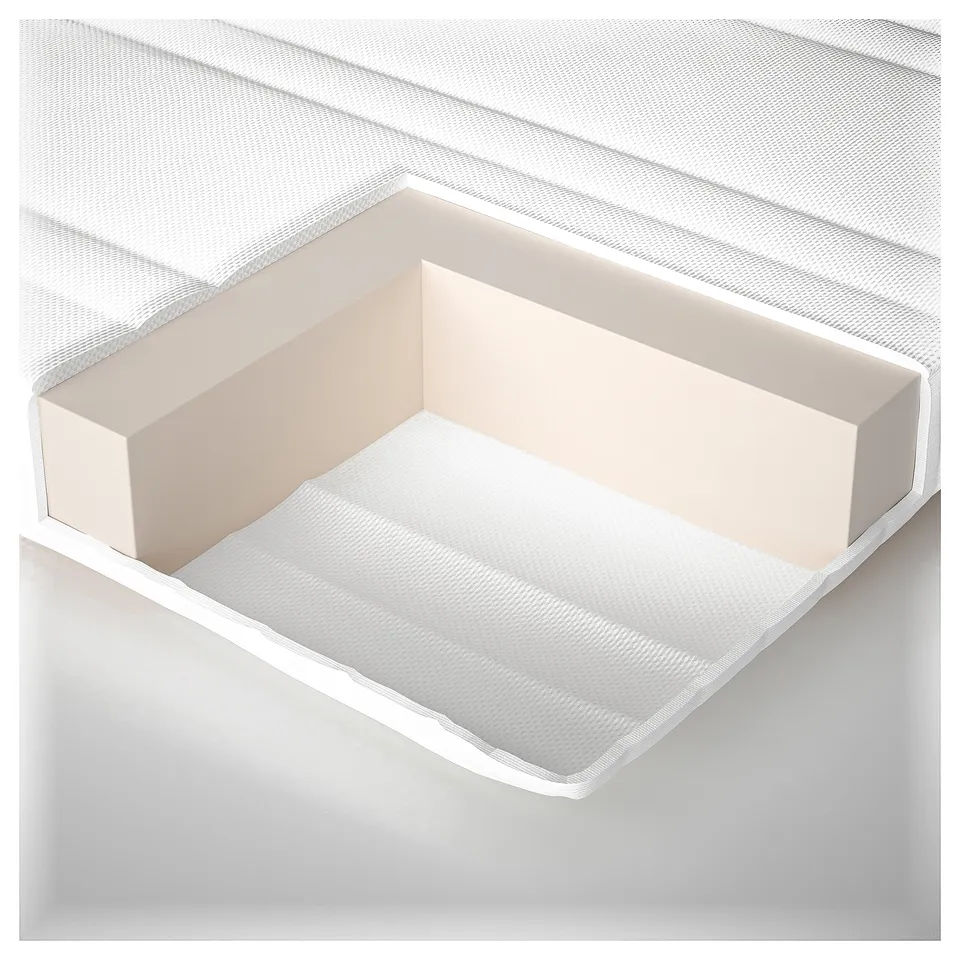 A mattress with a textured white cover and padding; elegantly designed. Made with recycled polyester and polypropylene.