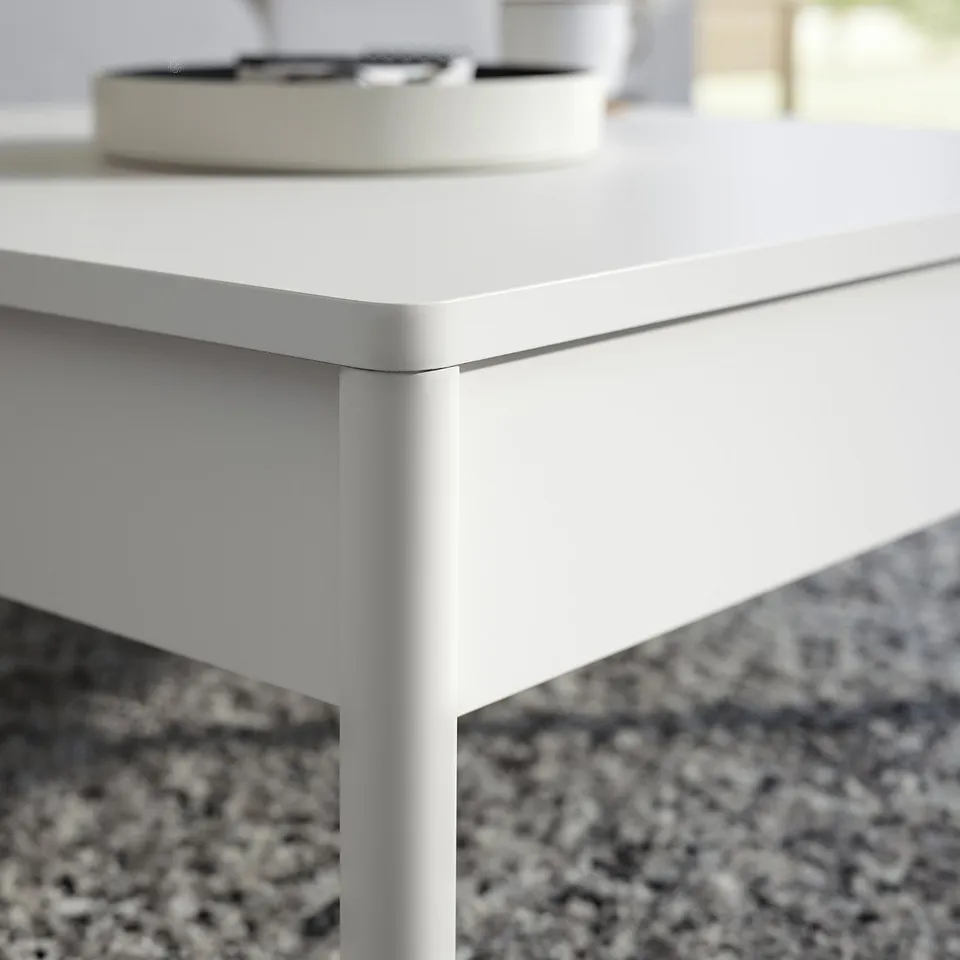 Minimalist white TONSTAD coffee table, sleek edges, two drawers, clean design.