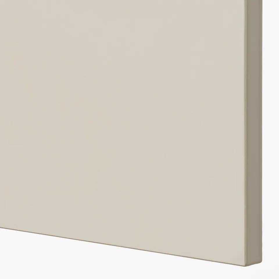 Smooth, beige kitchen cabinet door, part of high-quality METOD system.