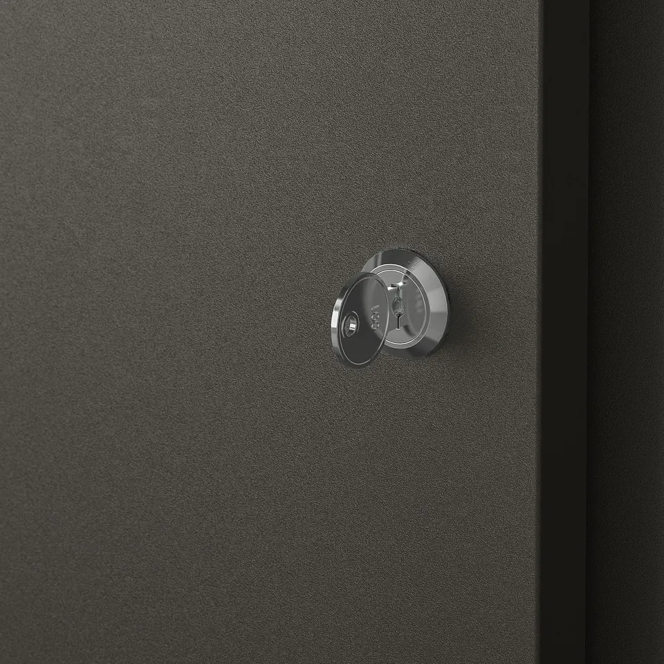 Modern, black metal cabinet with chrome handle and keyhole, showcasing high-quality craftsmanship and secure design.