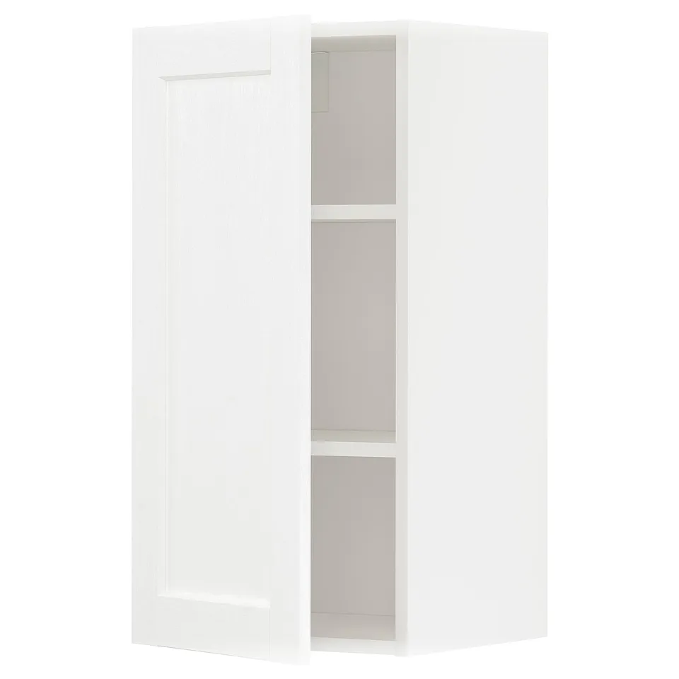 White METOD kitchen cabinet with adjustable shelf and reversible door.