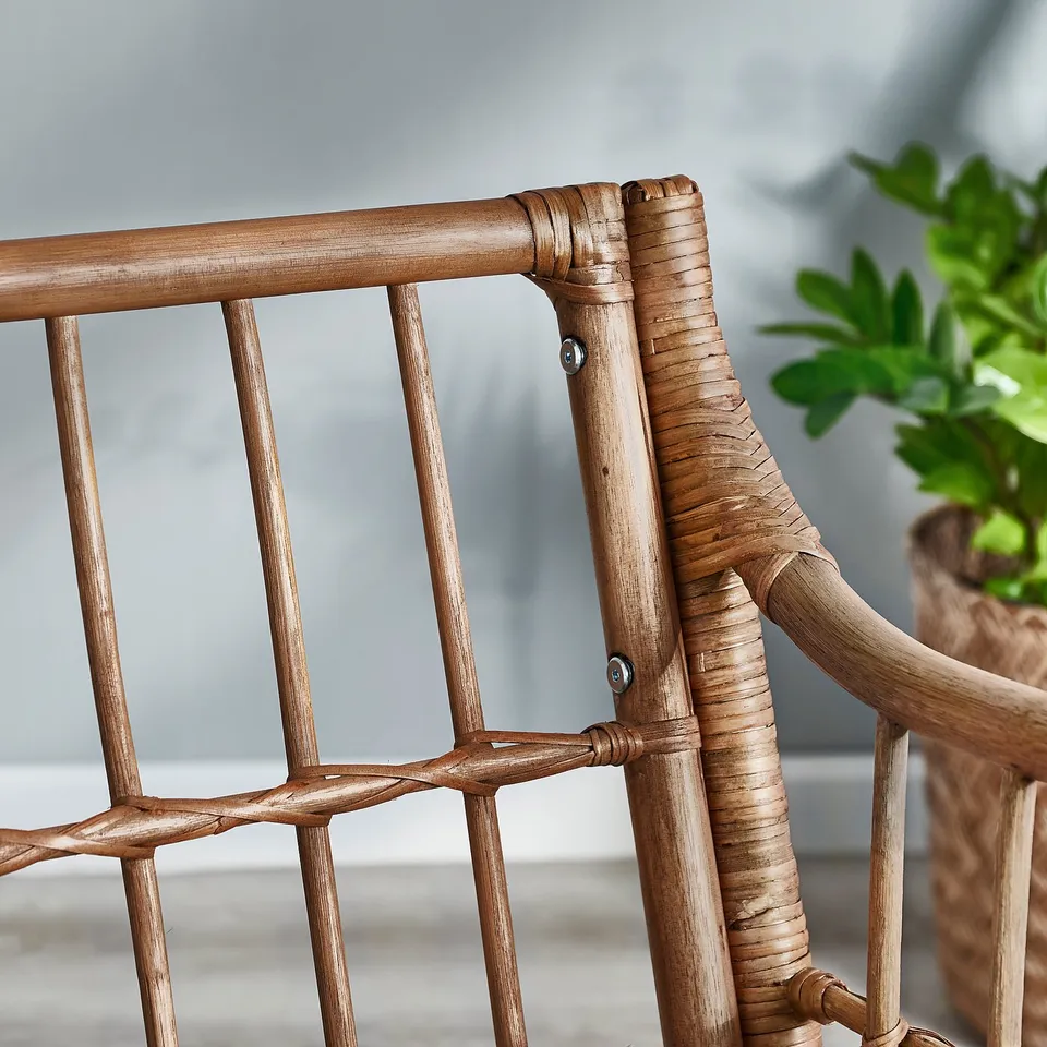 A close-up of a well-woven, handcrafted bamboo chair, highlighting its intricate design and durable construction.