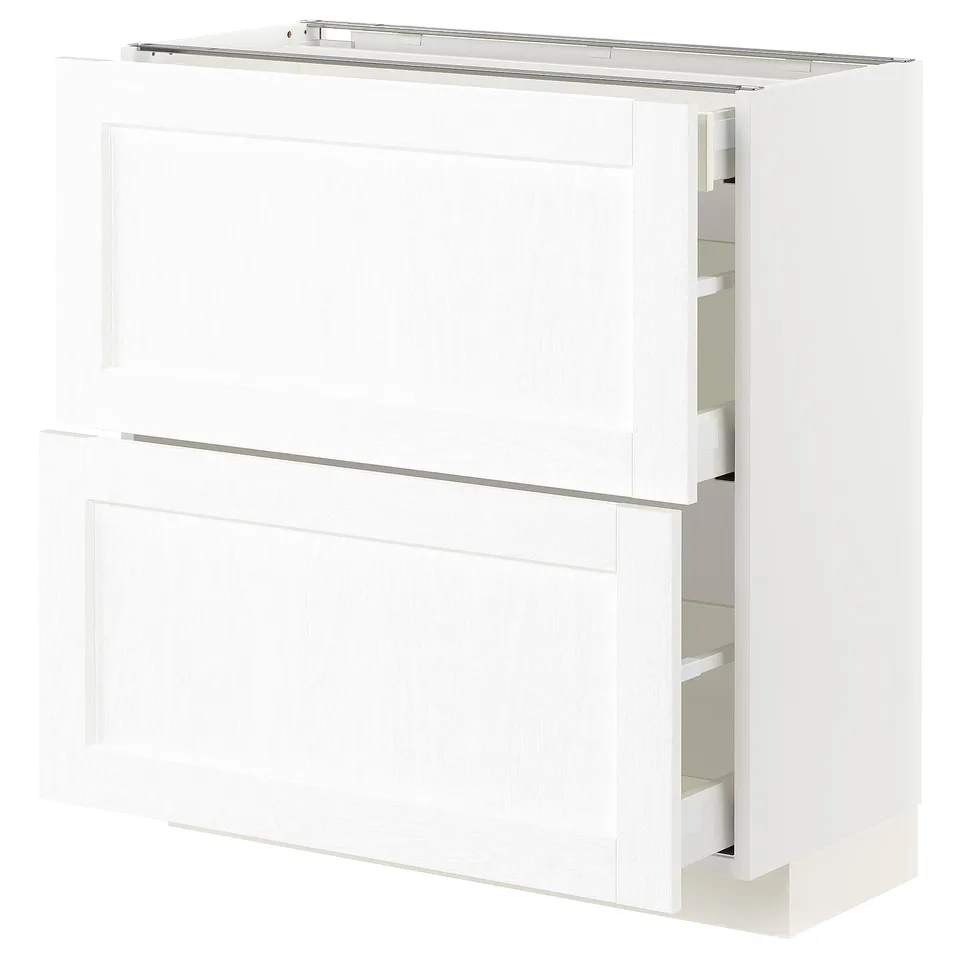 A white METOD kitchen cabinet with multiple drawers and shelves. It is sleek and modern designed for kitchen storage.