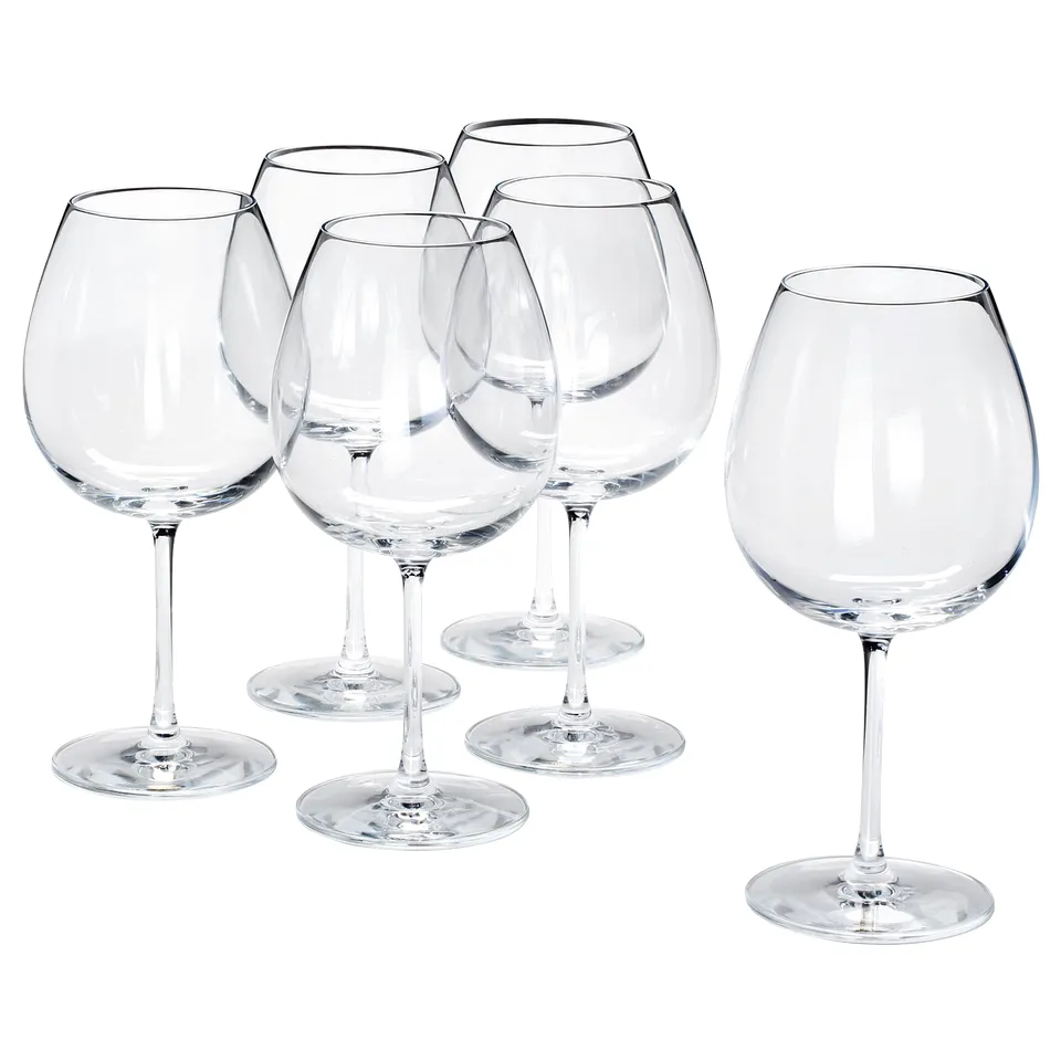 Six clear, crystalline wine glasses with long stems and large bowls, symmetrical design, arranged in a group.