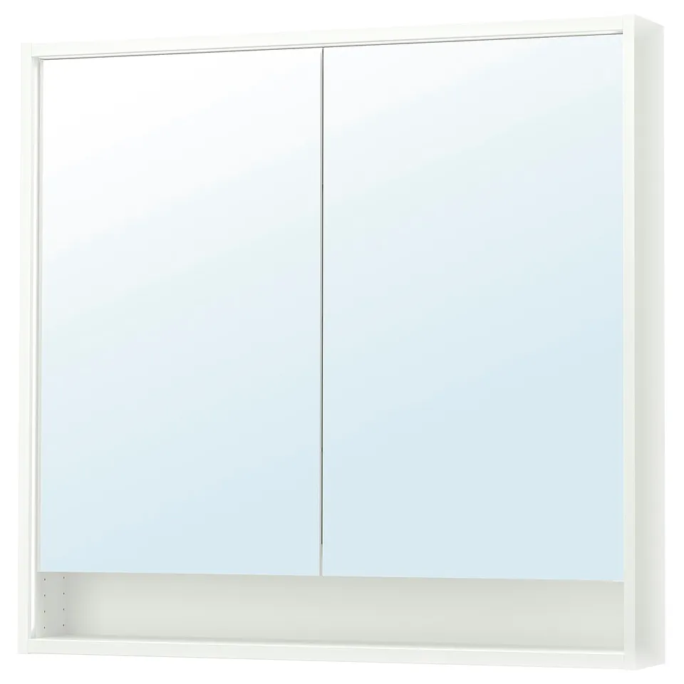 A white FAXÄLVEN mirror cabinet with integrated lighting and a storage shelf below. Its rectangular and sleek, with a modern design.